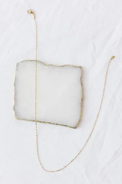 Exit Stage Left Necklace Gold